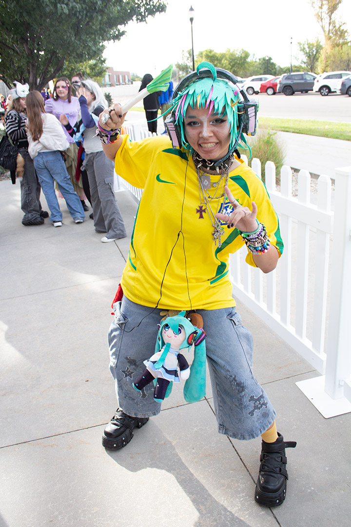 A cosplayer with bright colors and headphones