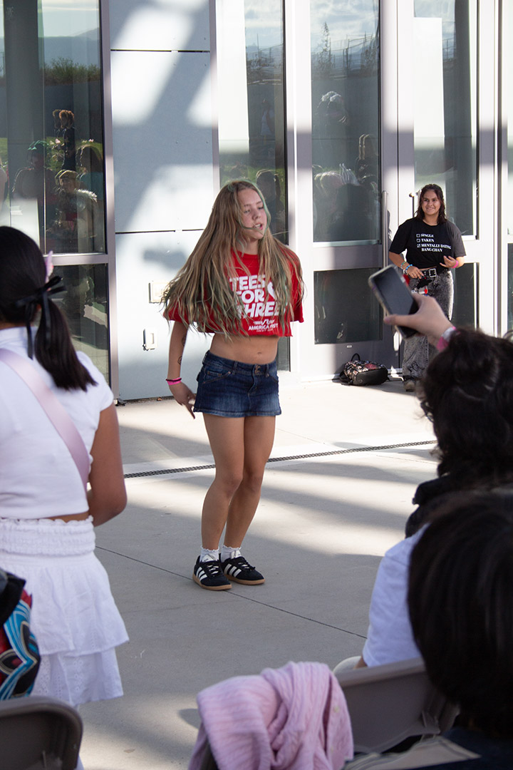 A girl dancing to K-pop