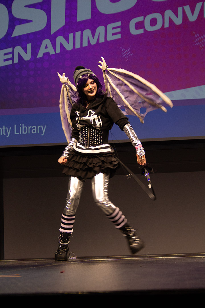 a girl cosplaying as a shiny demon
